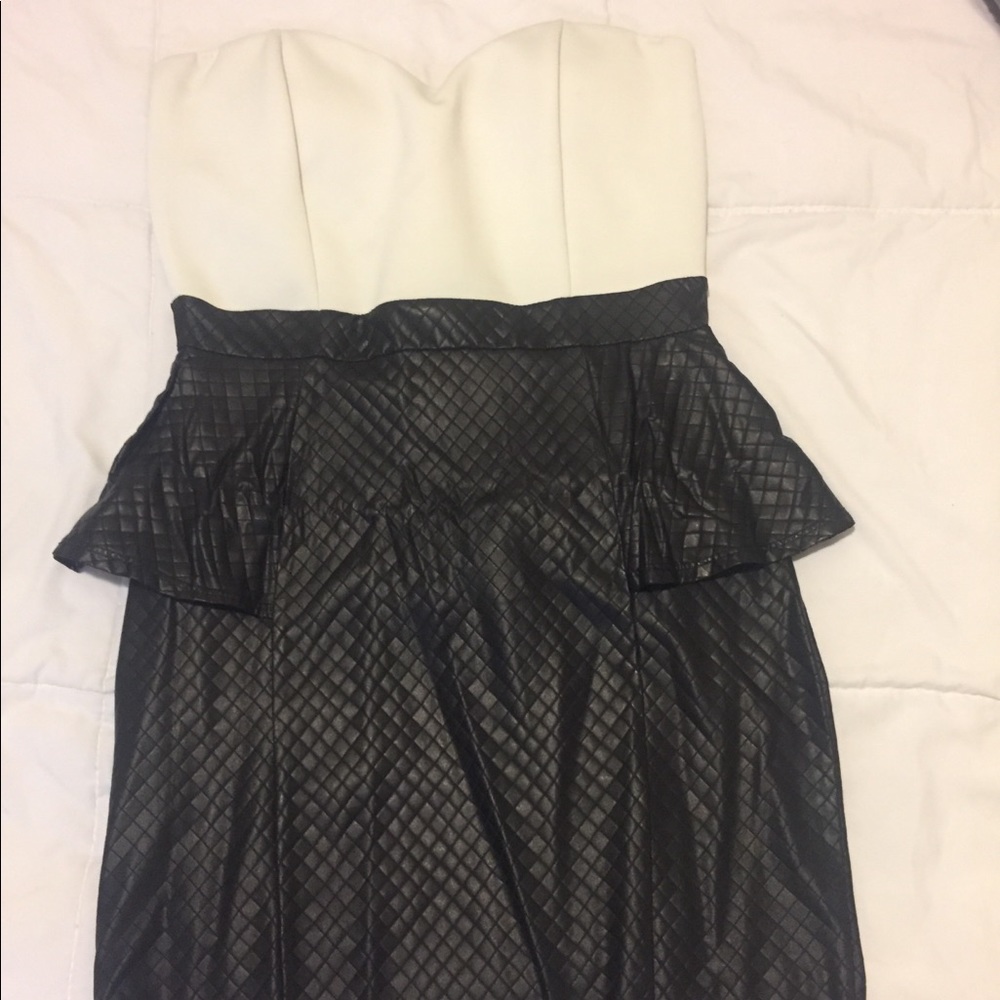 Mini dress leather black bottom and white top.